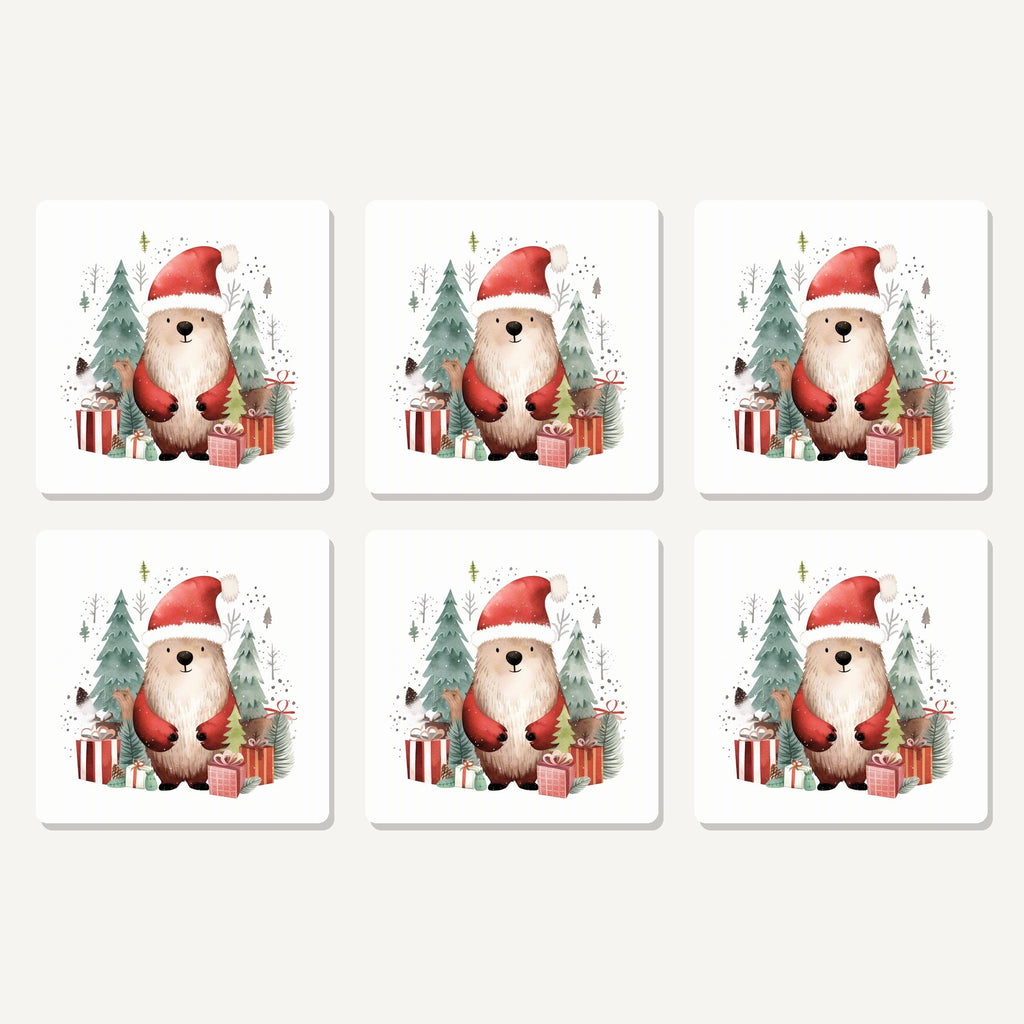 Flat lay of the christmas bear in santa hat artwork on six square coasters