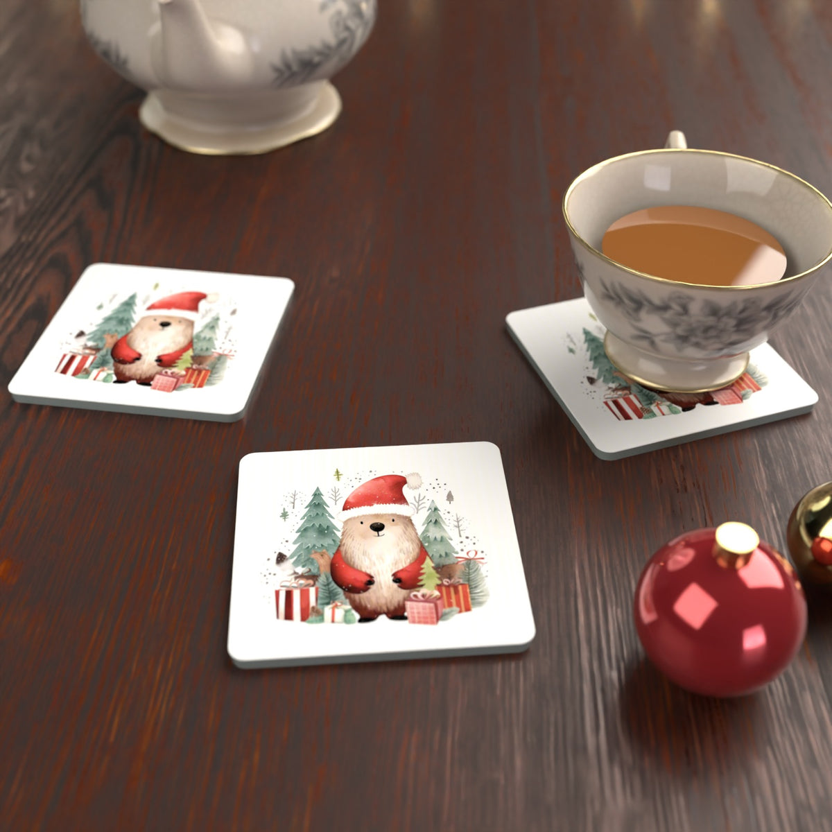 Christmas Bear in Santa Hat Square Glass Coasters – Set of 6 – lifestyle mockup with a teacup