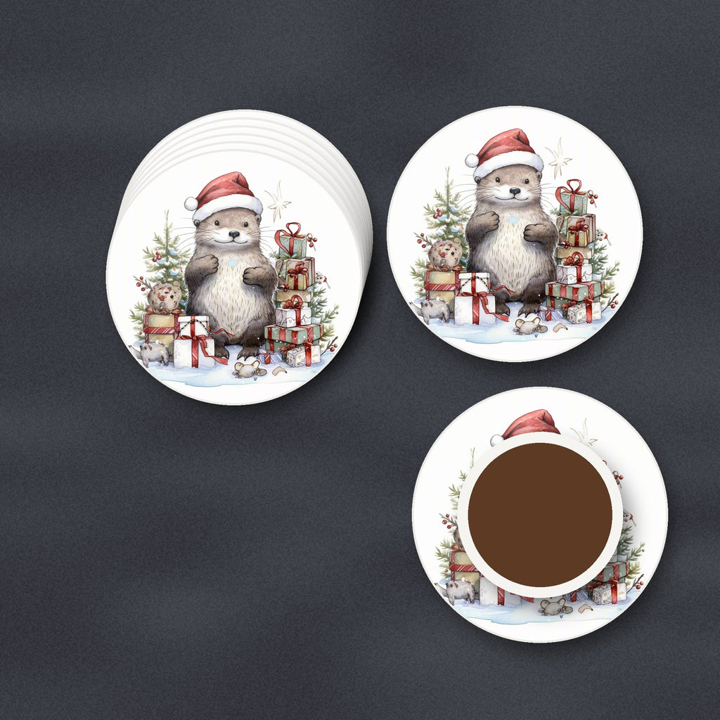 Christmas Otter with Gifts round ceramic coasters stacked on a slate kitchen worktop