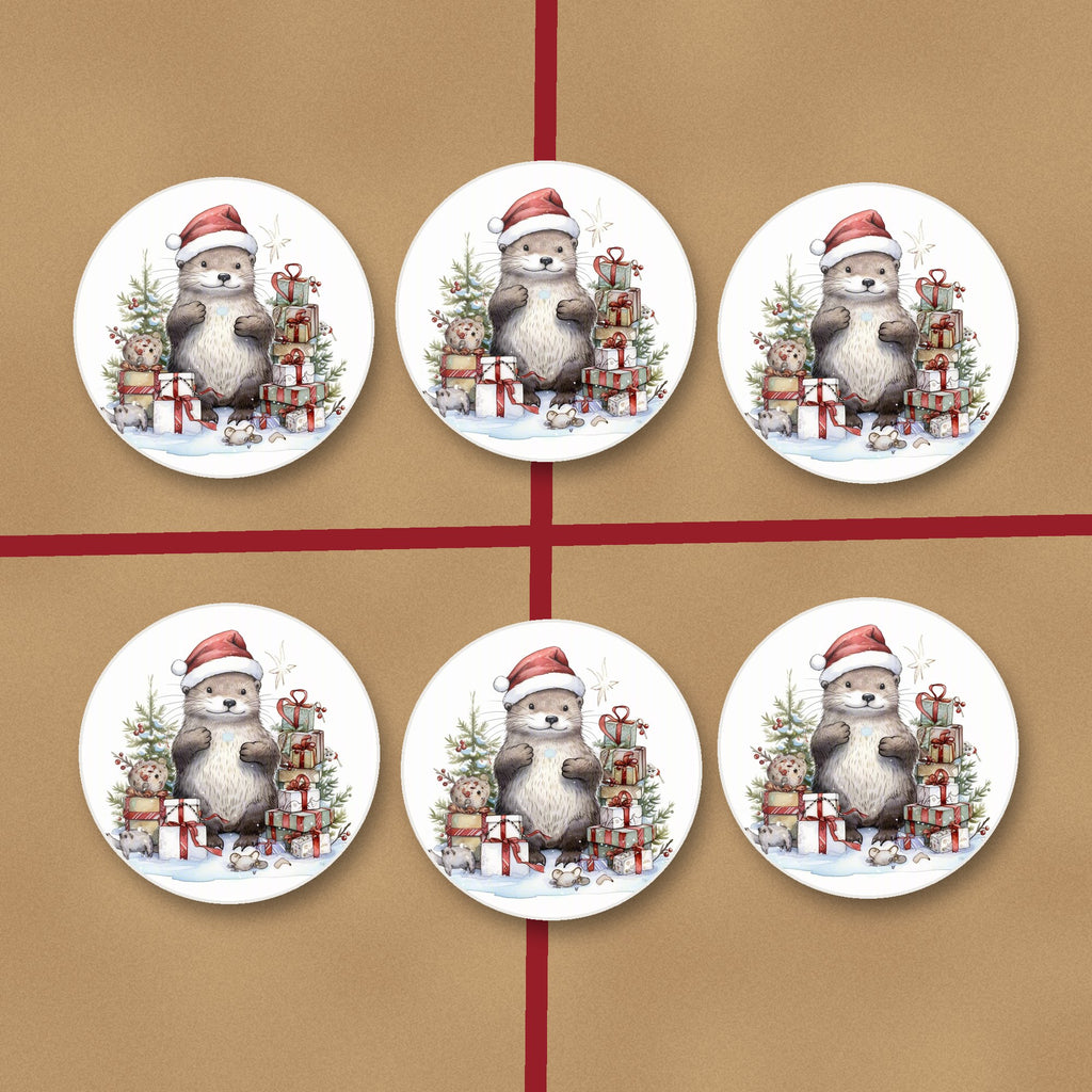 Christmas Otter with Gifts round ceramic coasters on kraft gift wrap