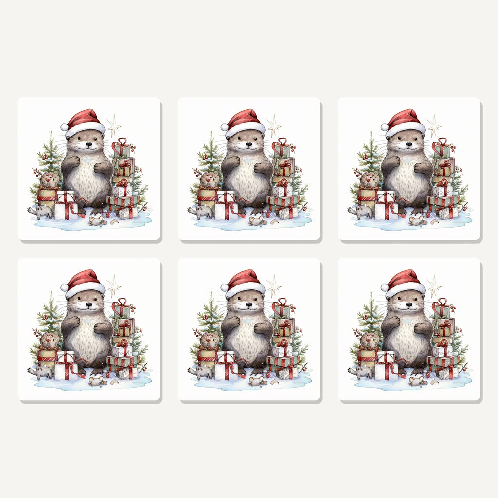 Flat lay of the christmas otter with gifts artwork on six square coasters