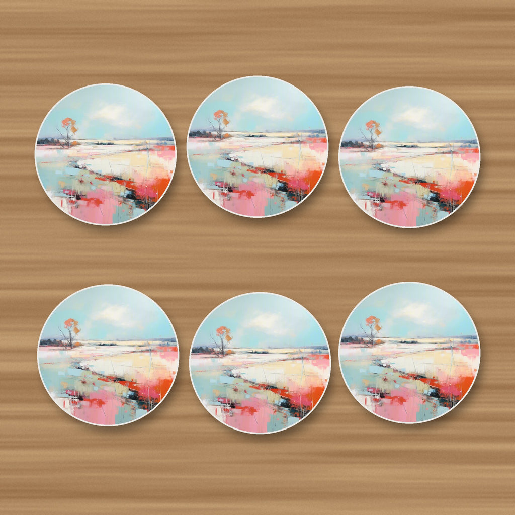 Pastel Abstract Landscape round ceramic coasters, set of 6, on an oak coffee table