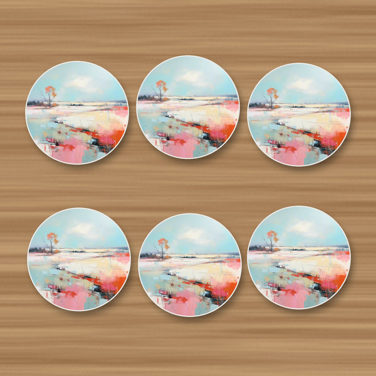 Pastel Abstract Landscape round ceramic coasters, set of 6, on an oak coffee table