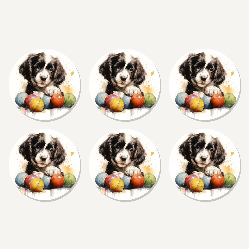 Flat lay of the springer spaniel puppy with balls artwork on six round coasters