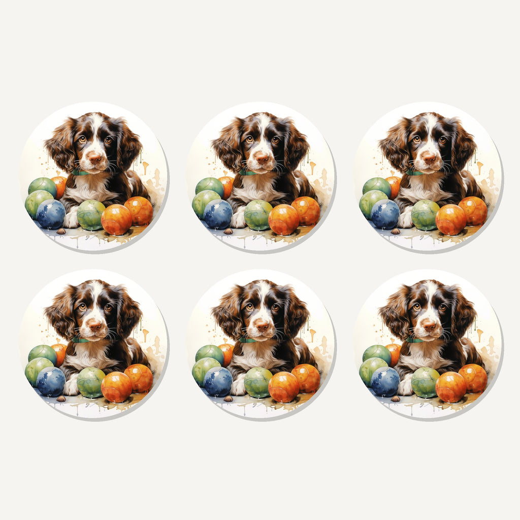 Flat lay of the brown springer spaniel puppy artwork on six round coasters