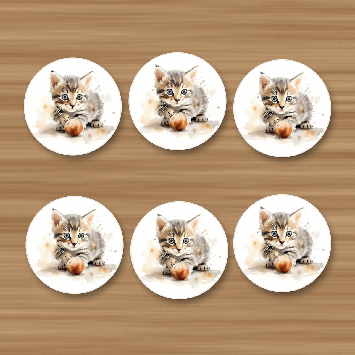 Tabby Kitten with Ball round ceramic coasters, set of 6, on an oak coffee table