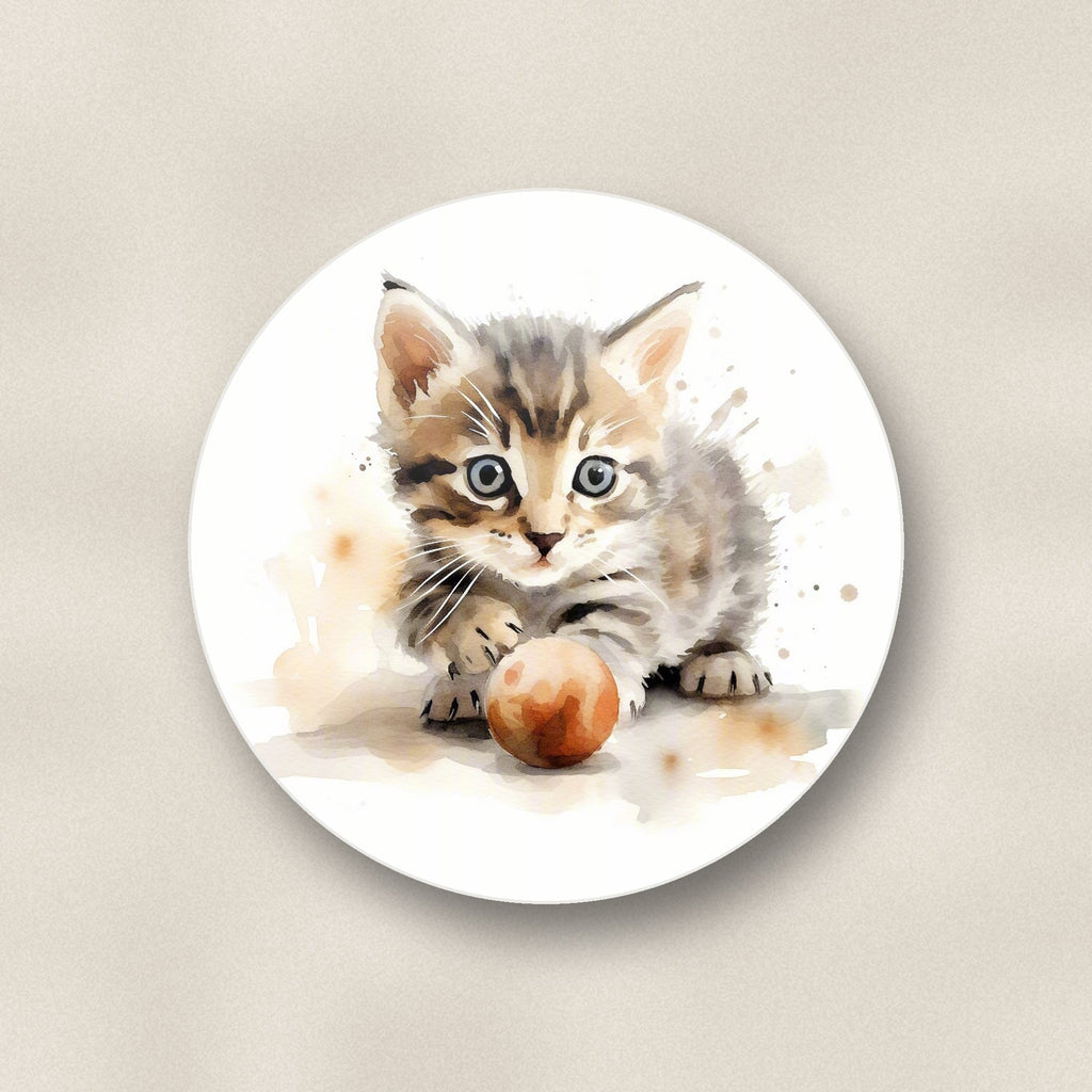 Close-up of one tabby kitten with ball round ceramic coaster, flat UV print