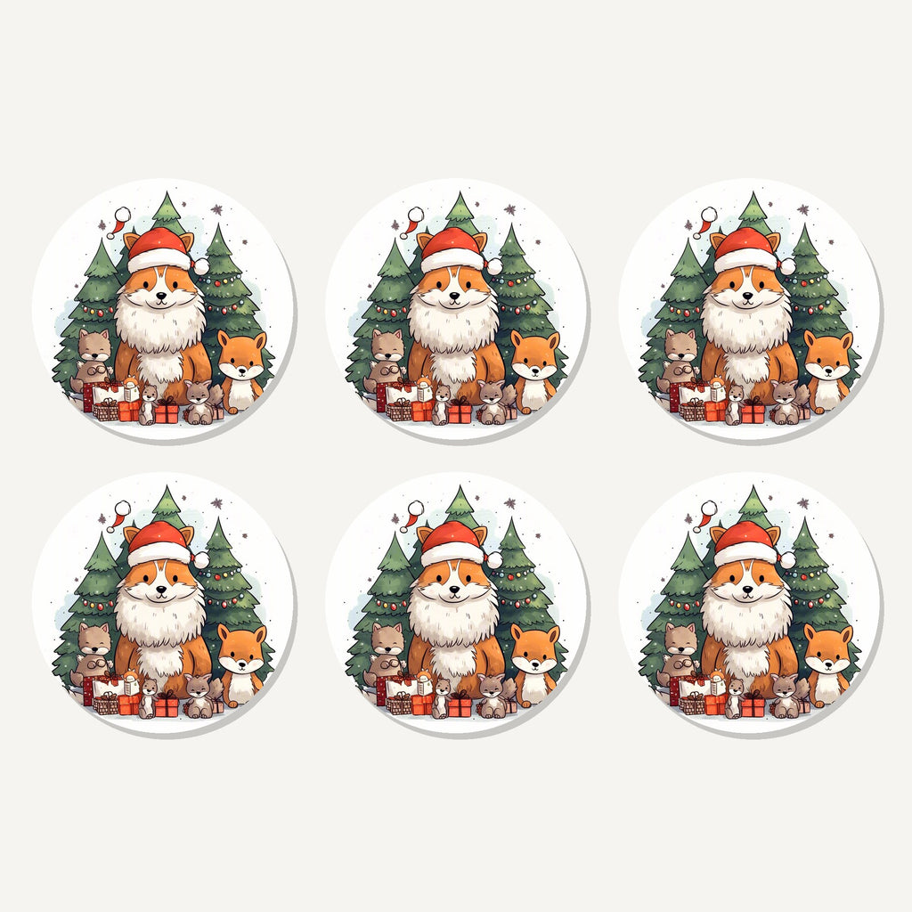 Flat lay of the christmas fox & woodland friends artwork on six round coasters