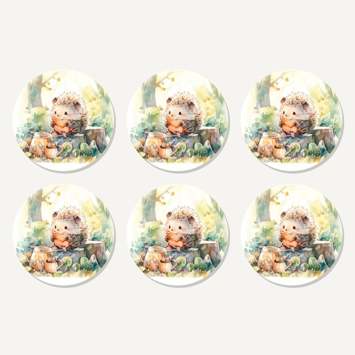 Flat lay of the watercolour woodland hedgehog artwork on six round coasters