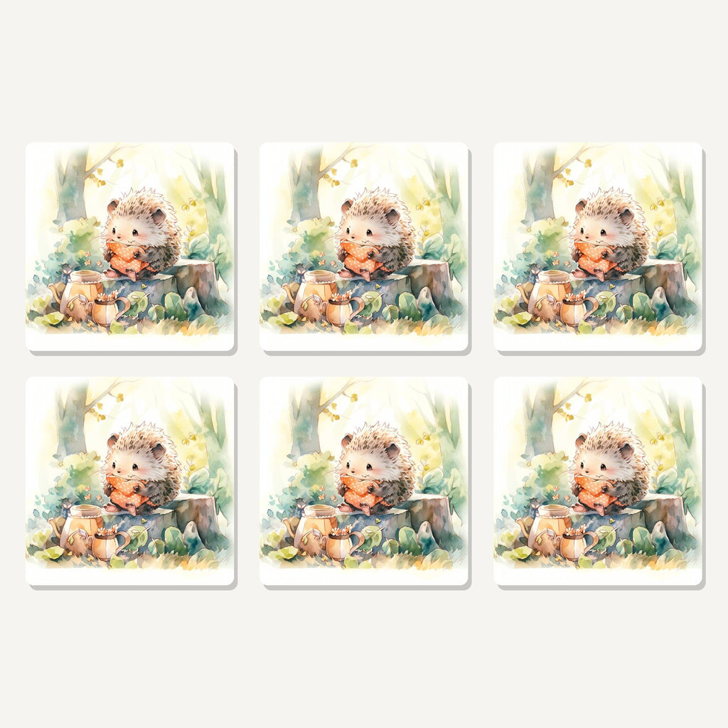 Flat lay of the watercolour woodland hedgehog artwork on six square coasters