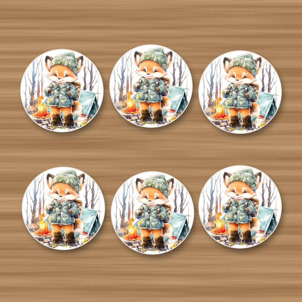 Fox Camping Watercolour round ceramic coasters, set of 6, on an oak coffee table