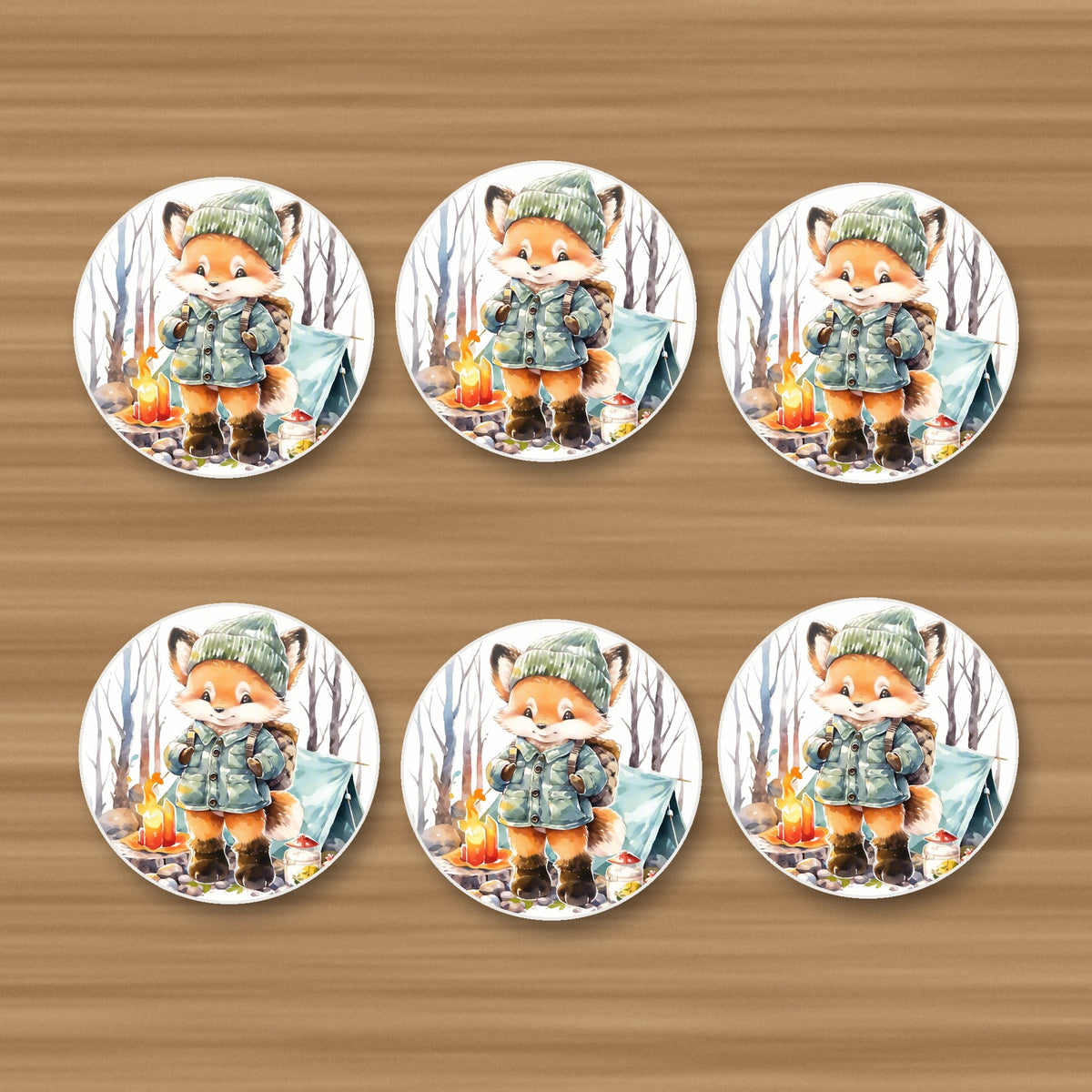 Fox Camping Watercolour round ceramic coasters, set of 6, on an oak coffee table