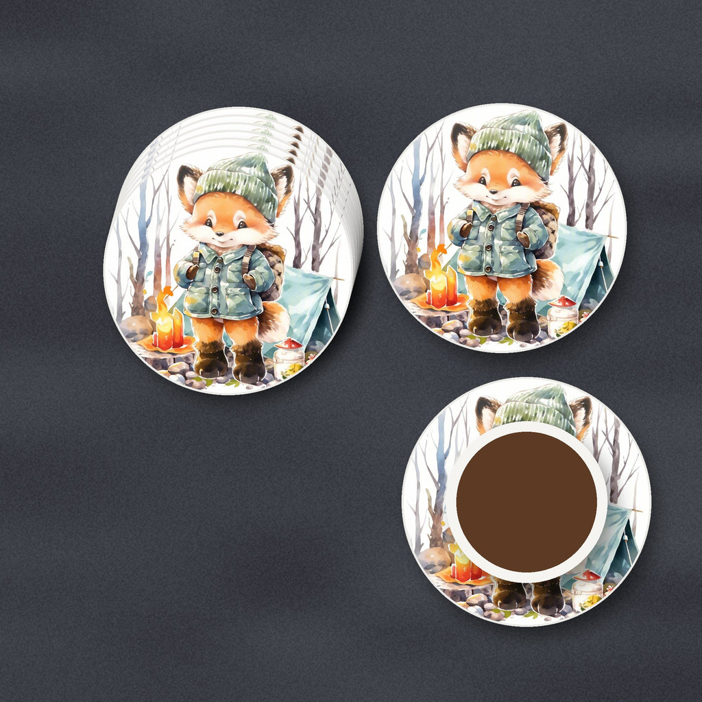 Fox Camping Watercolour round ceramic coasters stacked on a slate kitchen worktop