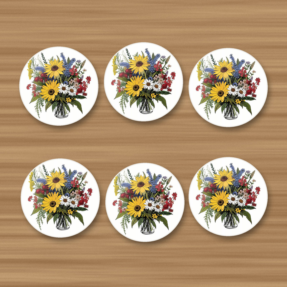 Sunflower & Wildflower Bouquet round ceramic coasters, set of 6, on an oak coffee table