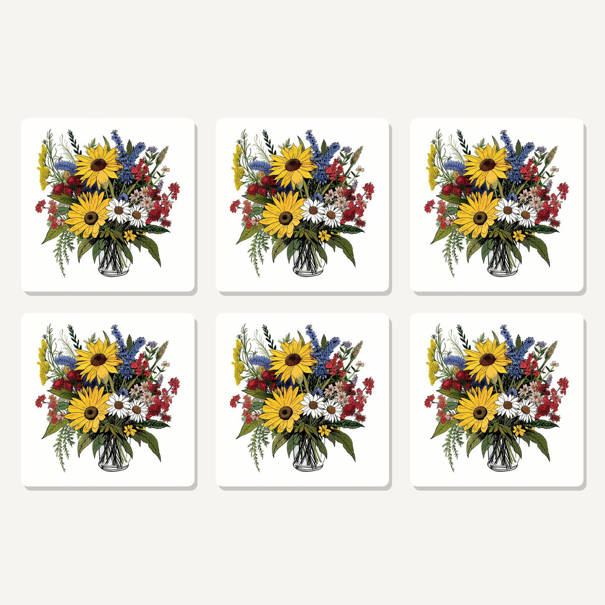 Flat lay of the sunflower & wildflower bouquet artwork on six square coasters