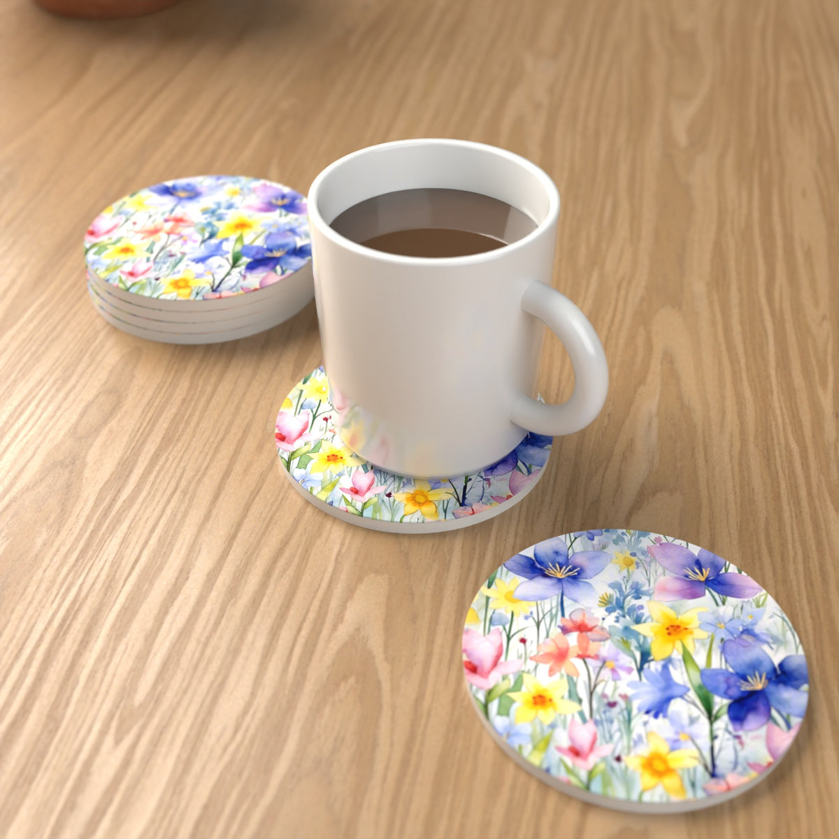 Watercolour Spring Flowers Round Ceramic Coasters – Set of 6 – lifestyle mockup with a mug of coffee