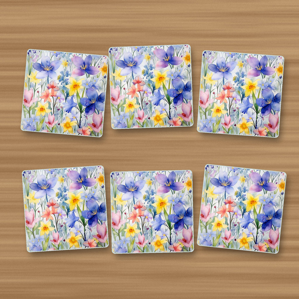 Watercolour Spring Flowers square glass coasters, set of 6, on an oak coffee table