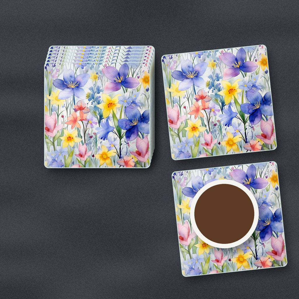 Watercolour Spring Flowers square glass coasters stacked on a slate kitchen worktop