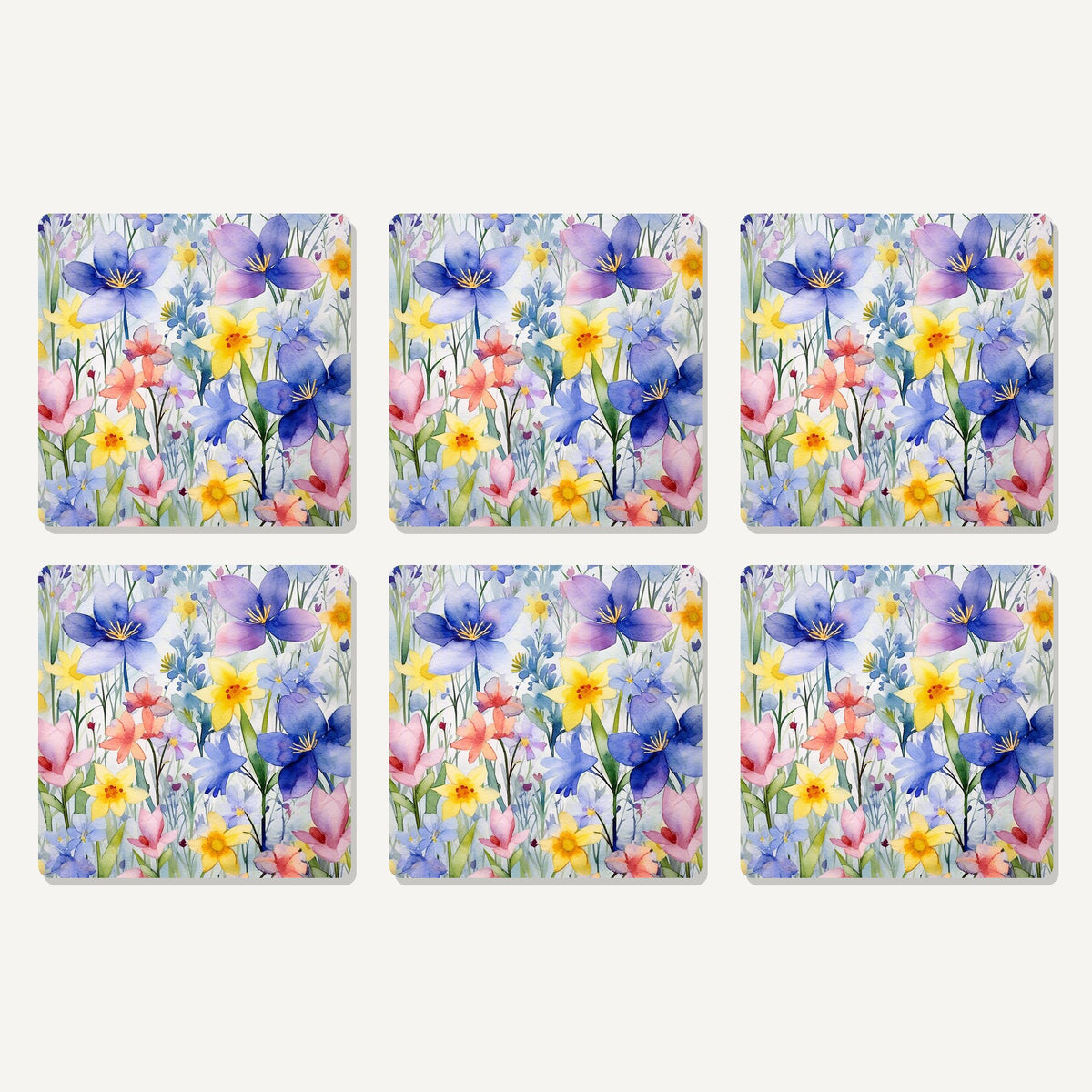 Flat lay of the watercolour spring flowers artwork on six square coasters