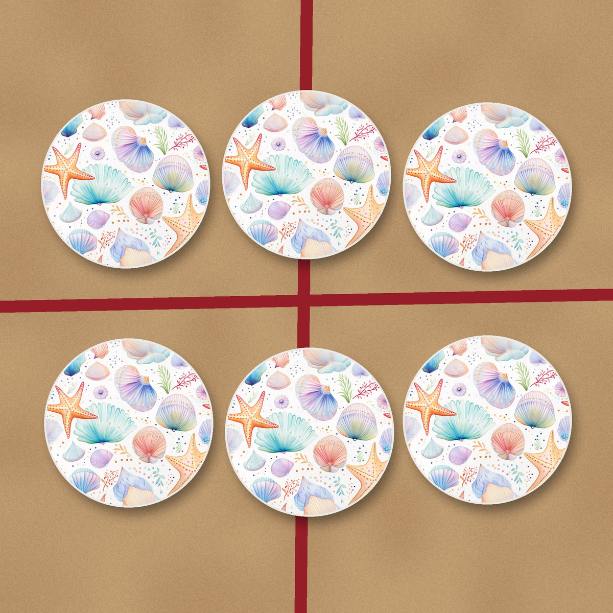 Watercolour Seashells & Starfish round ceramic coasters on kraft gift wrap