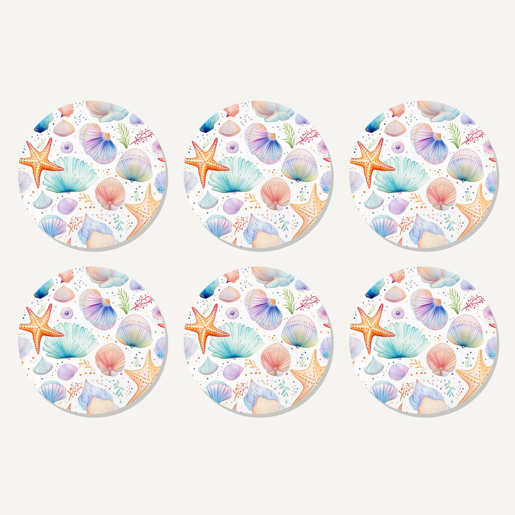 Flat lay of the watercolour seashells & starfish artwork on six round coasters
