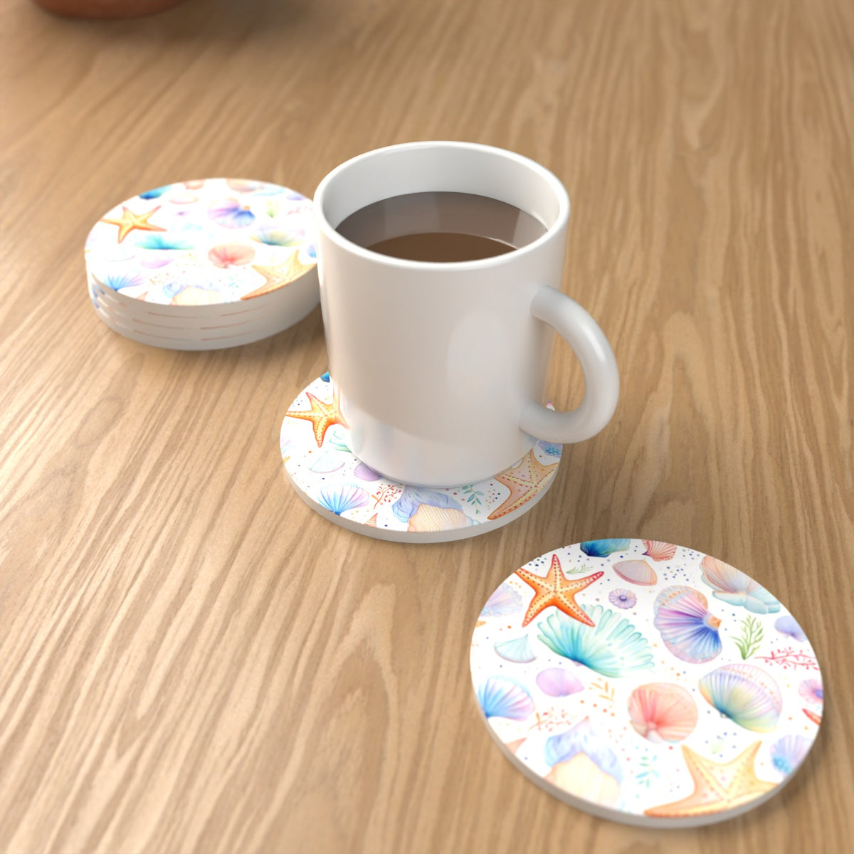 Watercolour Seashells & Starfish Round Ceramic Coasters – Set of 6 – lifestyle mockup with a mug of coffee