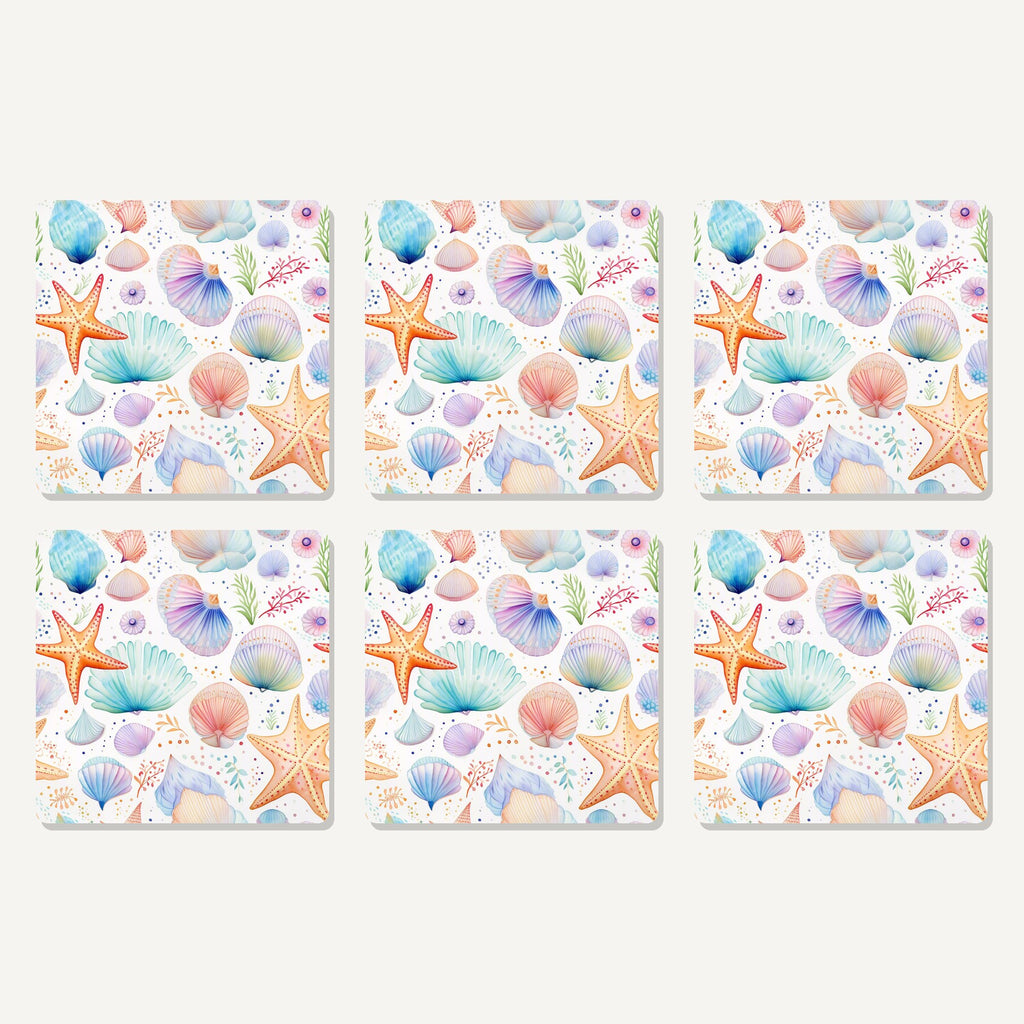 Flat lay of the watercolour seashells & starfish artwork on six square coasters
