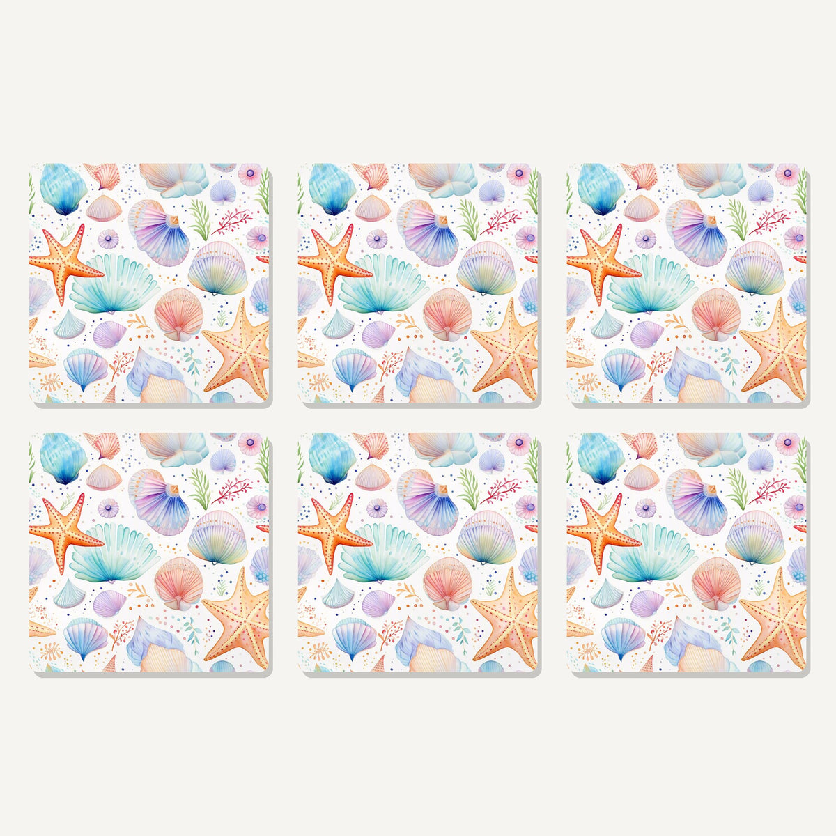 Flat lay of the watercolour seashells & starfish artwork on six square coasters