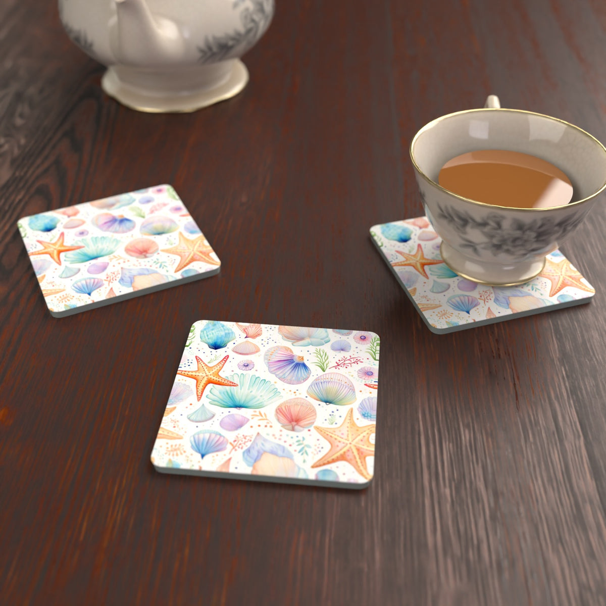 Watercolour Seashells & Starfish Square Glass Coasters – Set of 6 – lifestyle mockup with a teacup