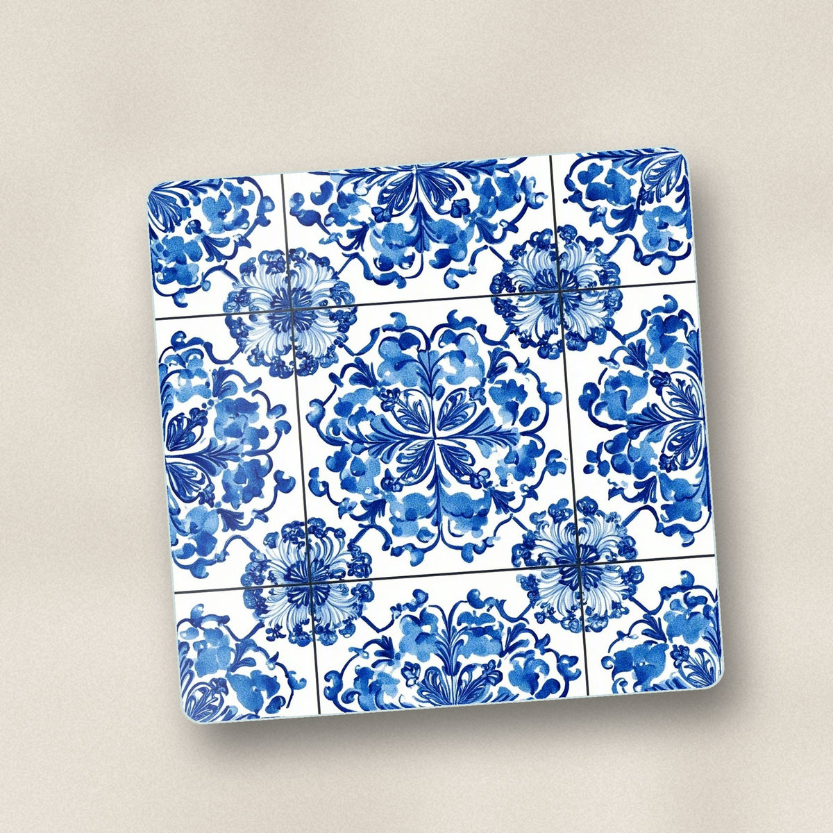 Close-up of one blue & white floral tile square glass coaster, flat UV print