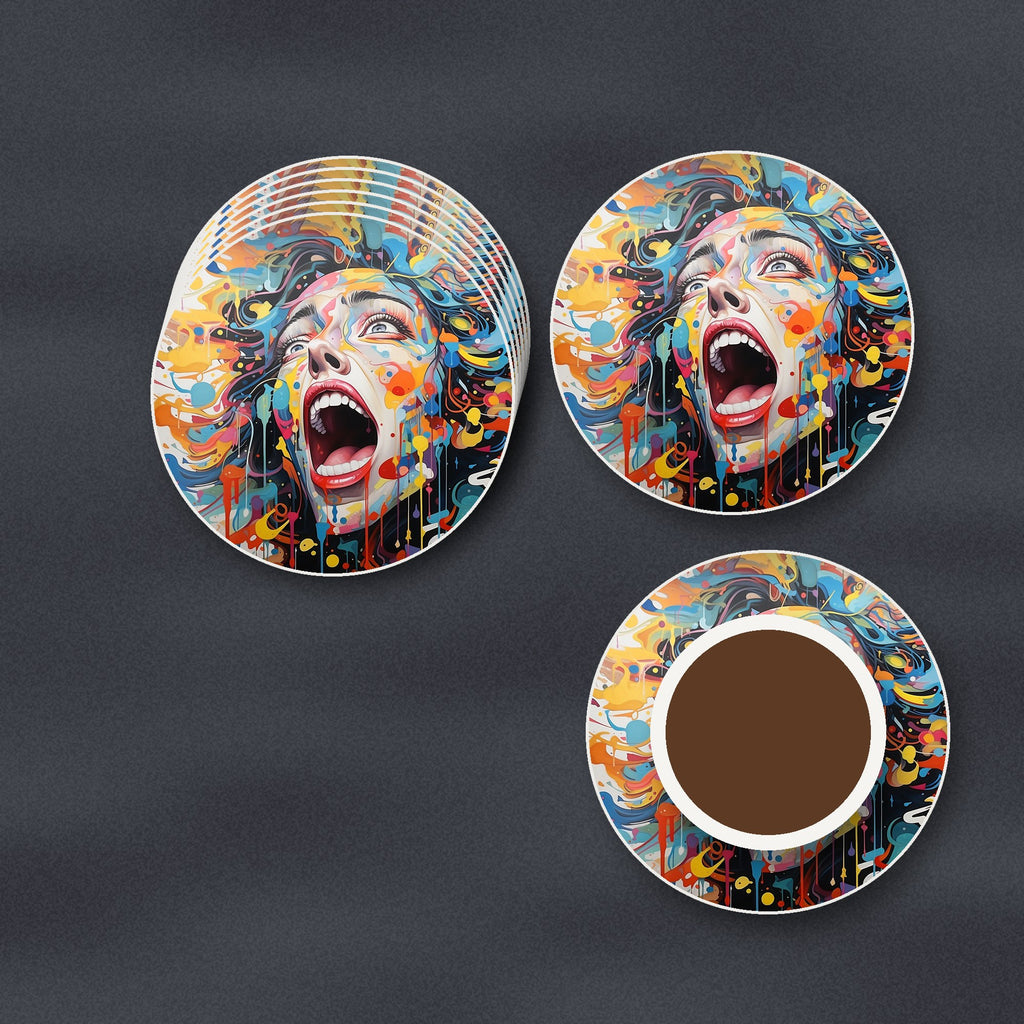 Graffiti Expressionist Face round ceramic coasters stacked on a slate kitchen worktop
