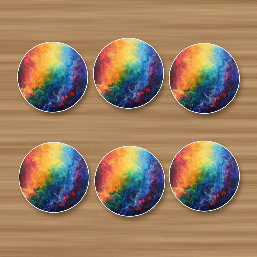 Rainbow Swirl Abstract round ceramic coasters, set of 6, on an oak coffee table