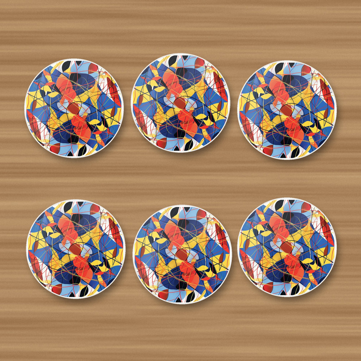 Abstract Lines & Shapes round ceramic coasters, set of 6, on an oak coffee table