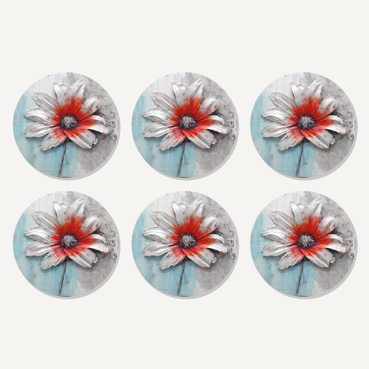 Flat lay of the white & red flower on pale blue artwork on six round coasters
