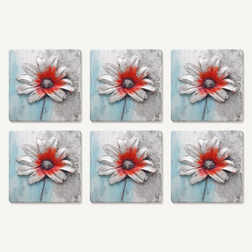 Flat lay of the white & red flower on pale blue artwork on six square coasters