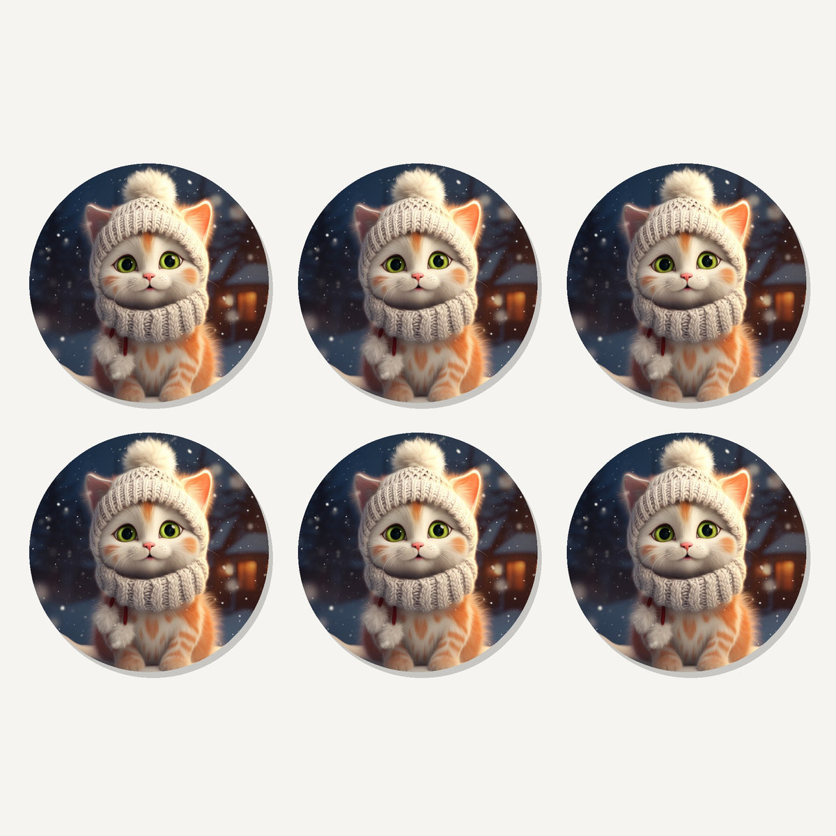 Flat lay of the kitten in a knitted bobble hat artwork on six round coasters