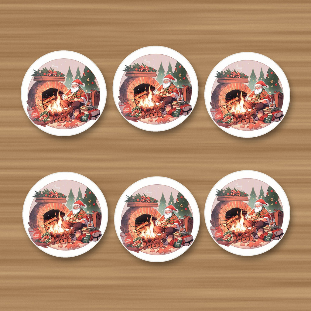 Father Christmas by the Fireside round ceramic coasters, set of 6, on an oak coffee table