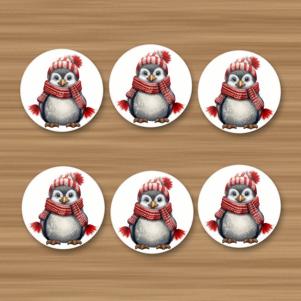Penguin in a Red Bobble Hat round ceramic coasters, set of 6, on an oak coffee table