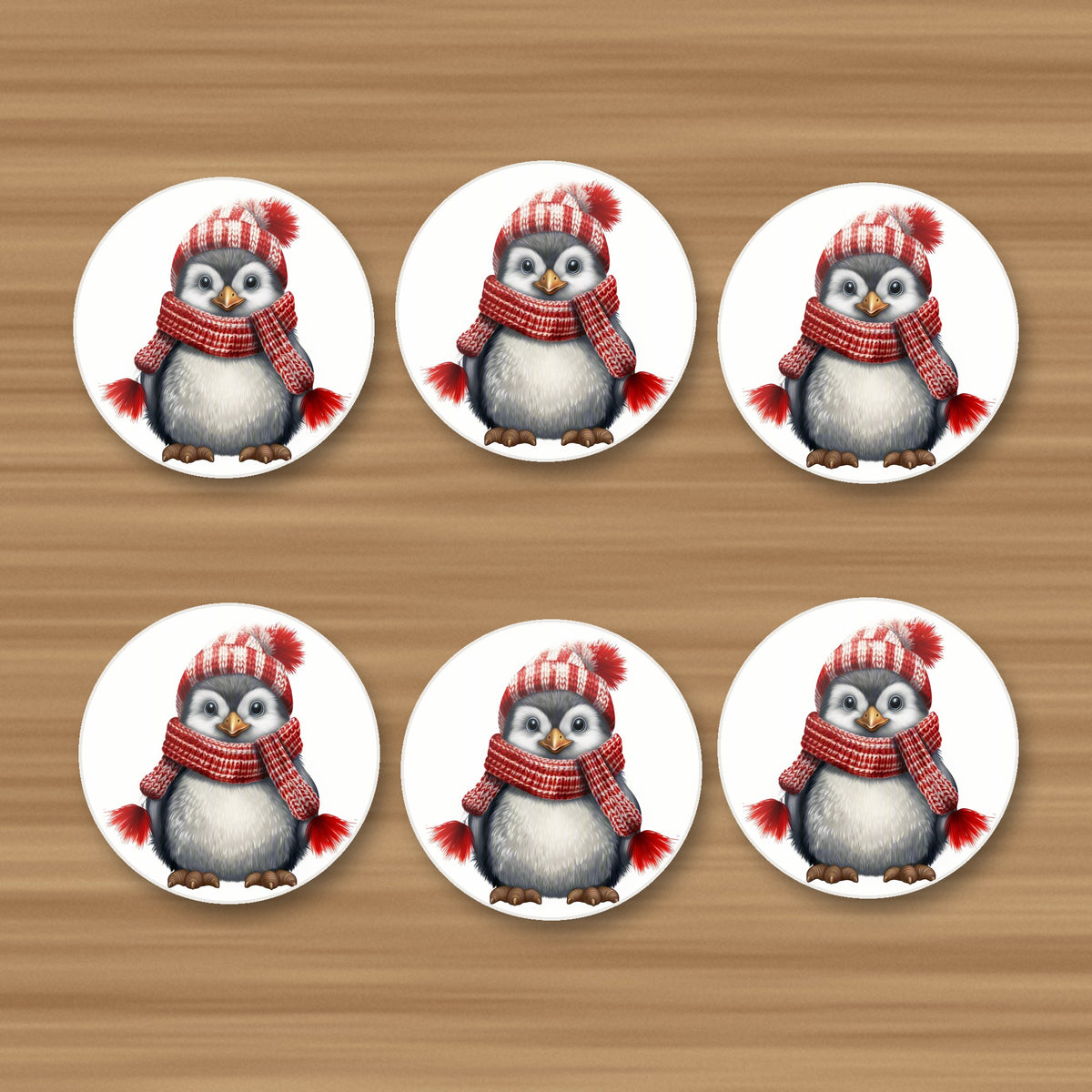 Penguin in a Red Bobble Hat round ceramic coasters, set of 6, on an oak coffee table