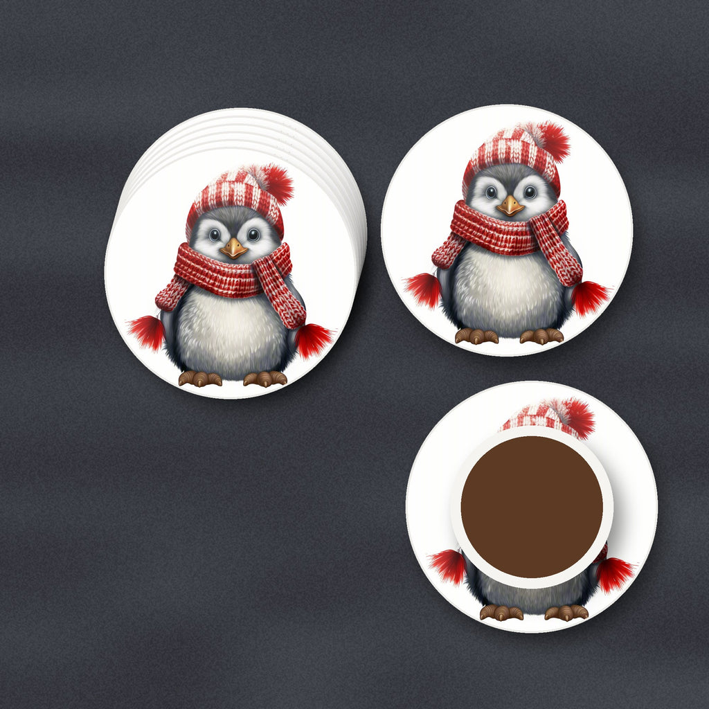 Penguin in a Red Bobble Hat round ceramic coasters stacked on a slate kitchen worktop