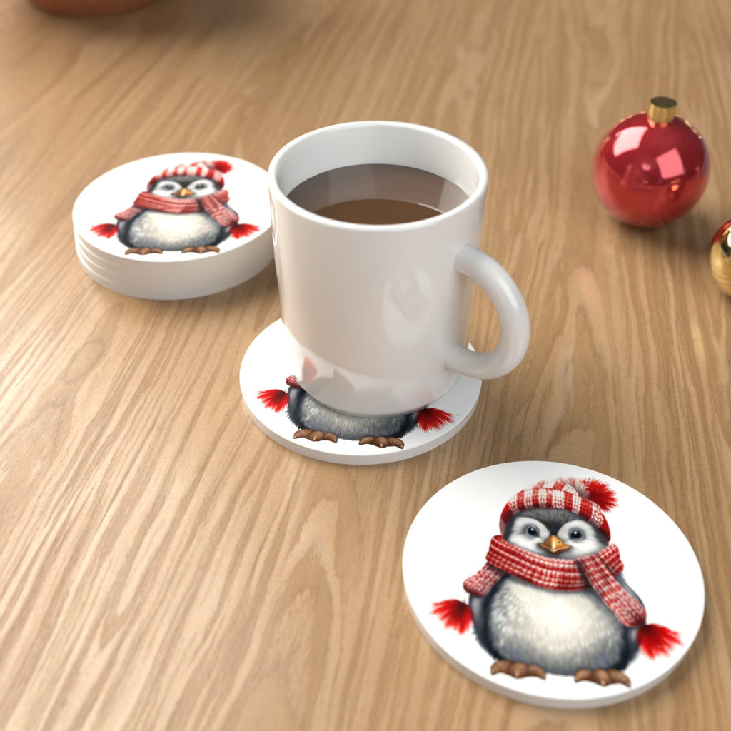 Penguin in a Red Bobble Hat Round Ceramic Coasters – Set of 6 – lifestyle mockup with a mug of coffee