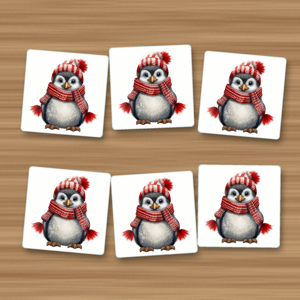 Penguin in a Red Bobble Hat square glass coasters, set of 6, on an oak coffee table