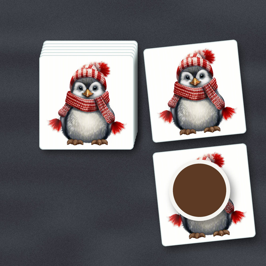 Penguin in a Red Bobble Hat square glass coasters stacked on a slate kitchen worktop