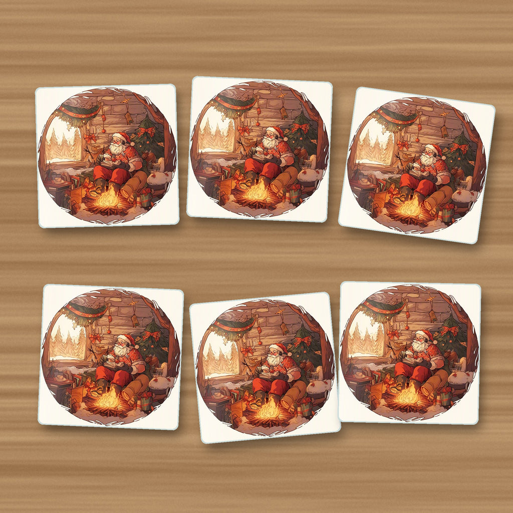 Father Christmas Cabin Fireside square glass coasters, set of 6, on an oak coffee table