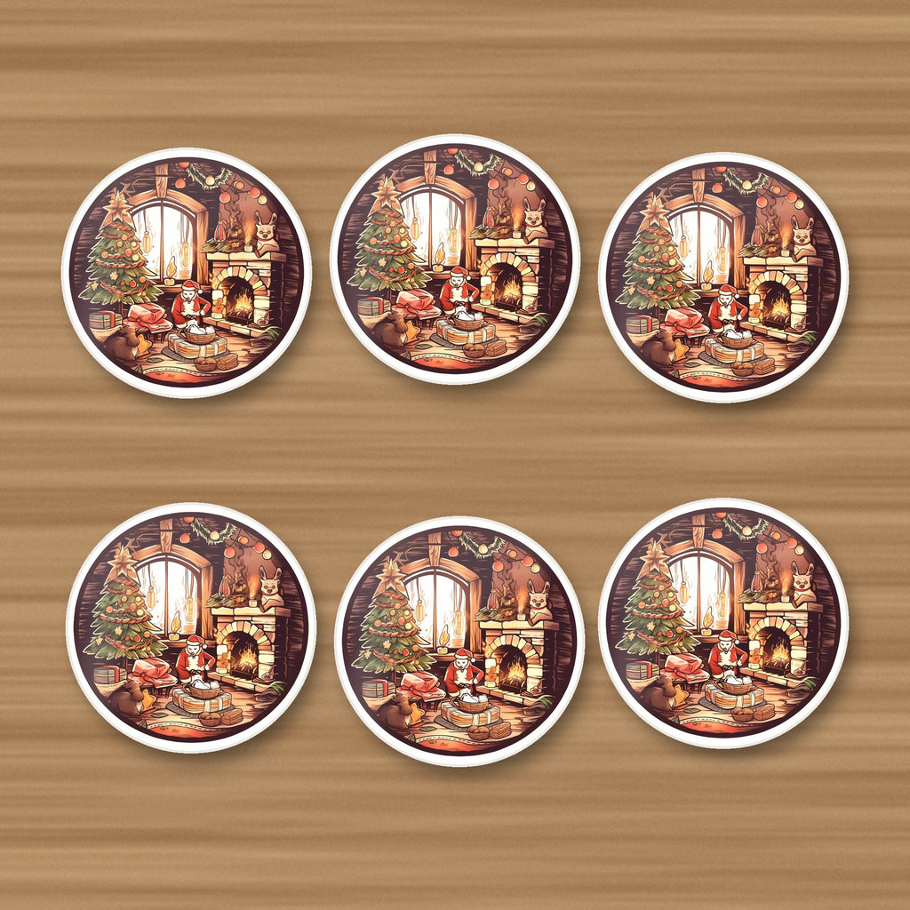 Christmas Cottage Fireside round ceramic coasters, set of 6, on an oak coffee table