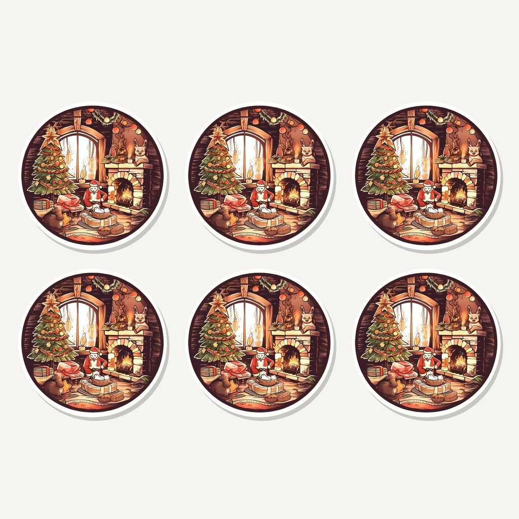 Flat lay of the christmas cottage fireside artwork on six round coasters