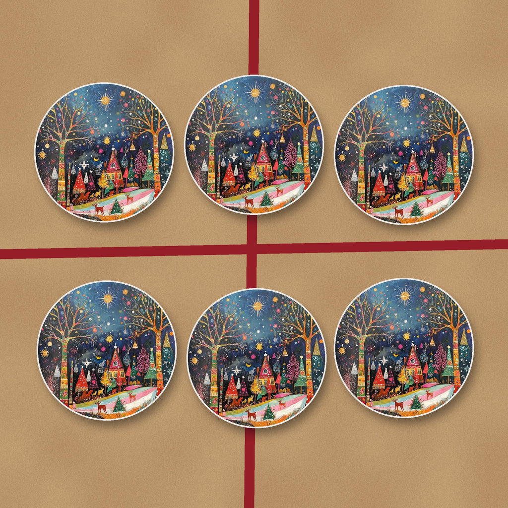 Folk Art Night Village round ceramic coasters on kraft gift wrap