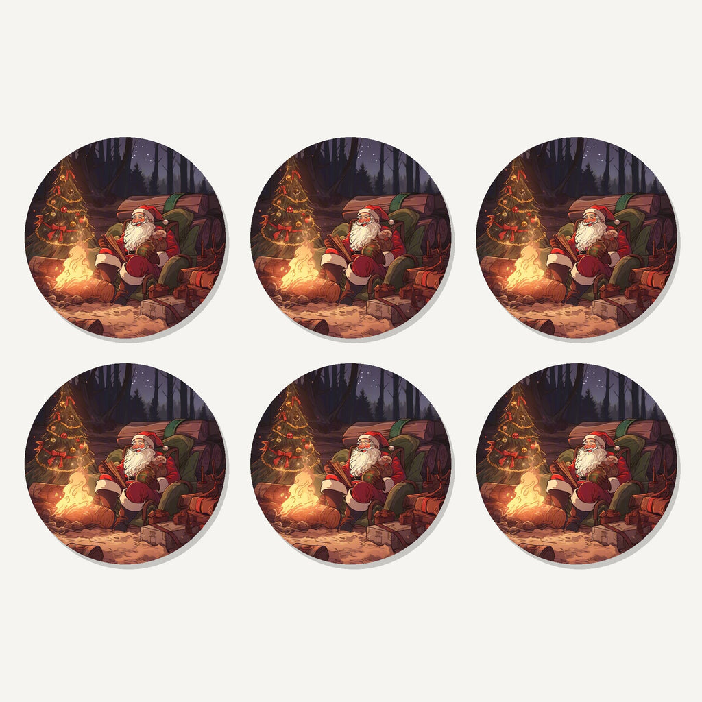 Flat lay of the father christmas forest fireside artwork on six round coasters