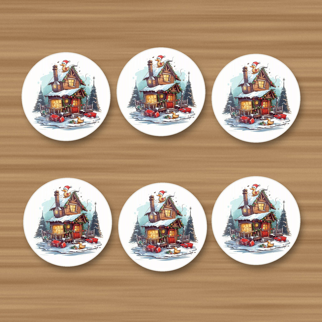 Snowy Log Cabin with Ducks round ceramic coasters, set of 6, on an oak coffee table