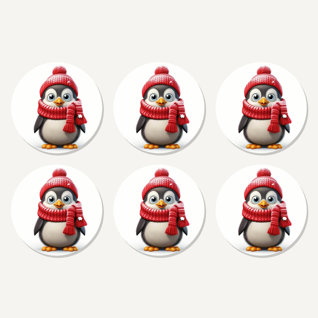 Flat lay of the cheerful penguin in red hat & scarf artwork on six round coasters